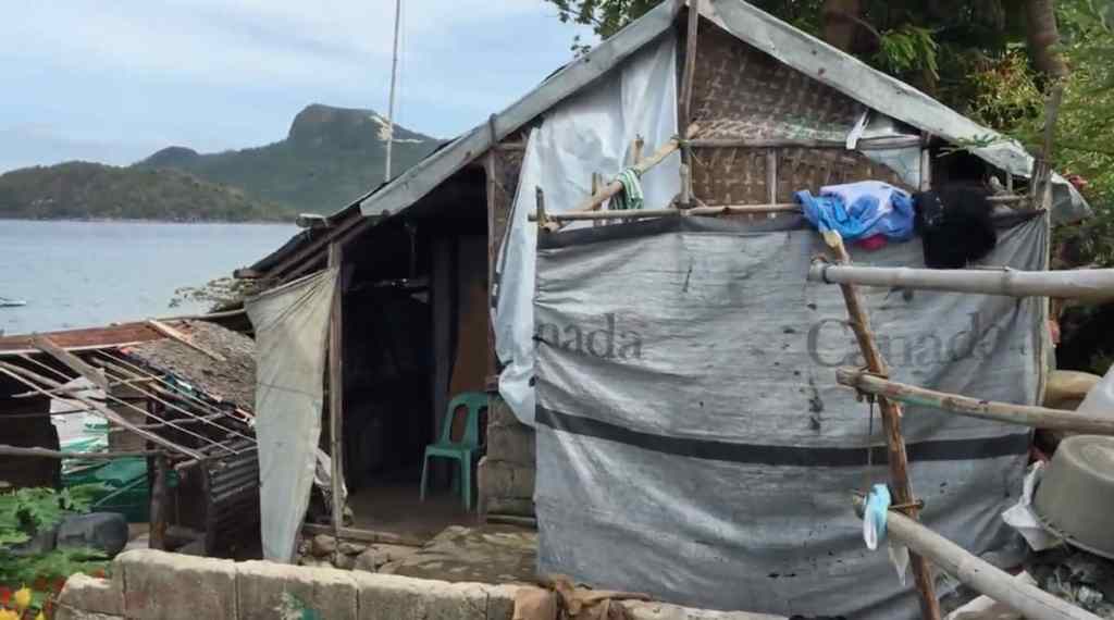 typhoon damaged bamboo house philippines