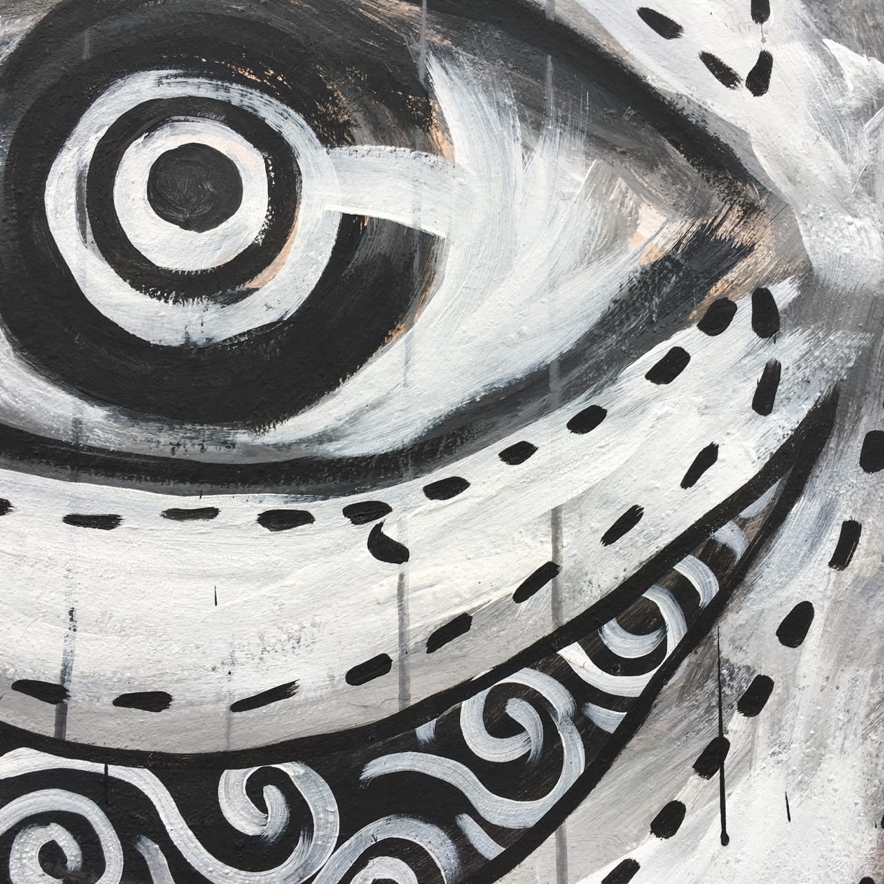 black and white abstract mural of an eye
