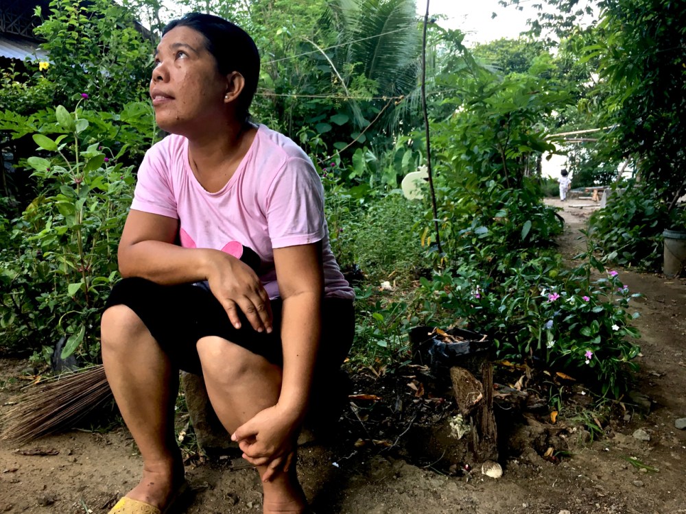 Filipina sitting in the garden