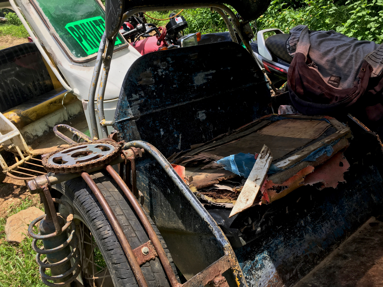 tricycle with a ripped up seat