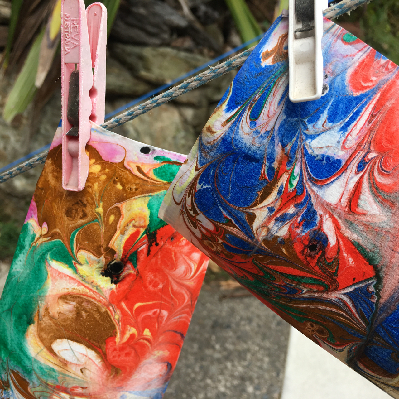 paper marbling hanging to dry