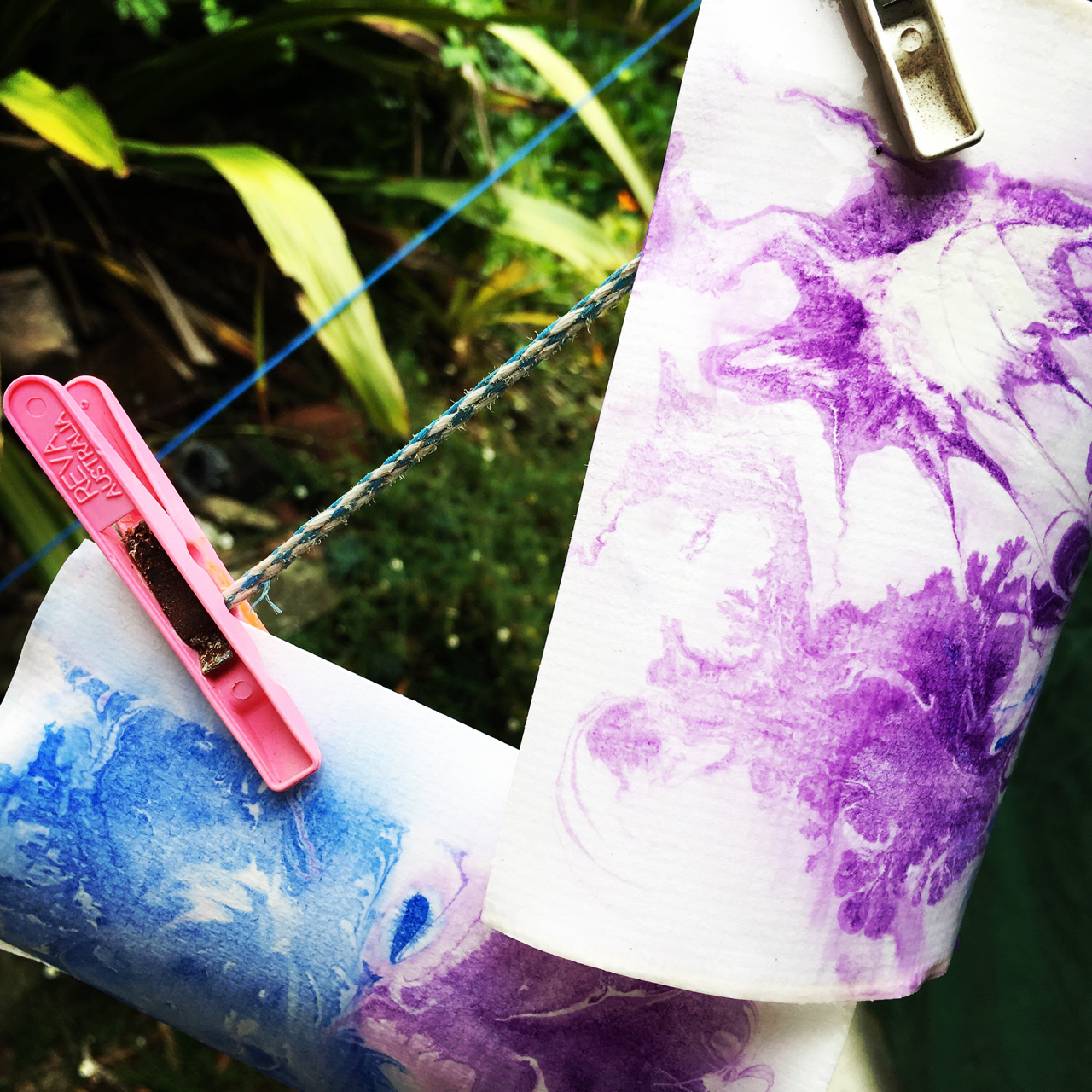 paper marbling hanging to dry