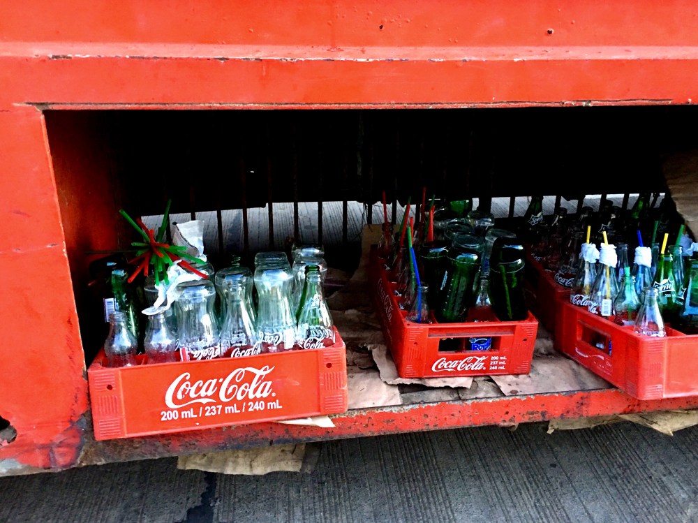 empty coke and sprite bottles ready for recycling