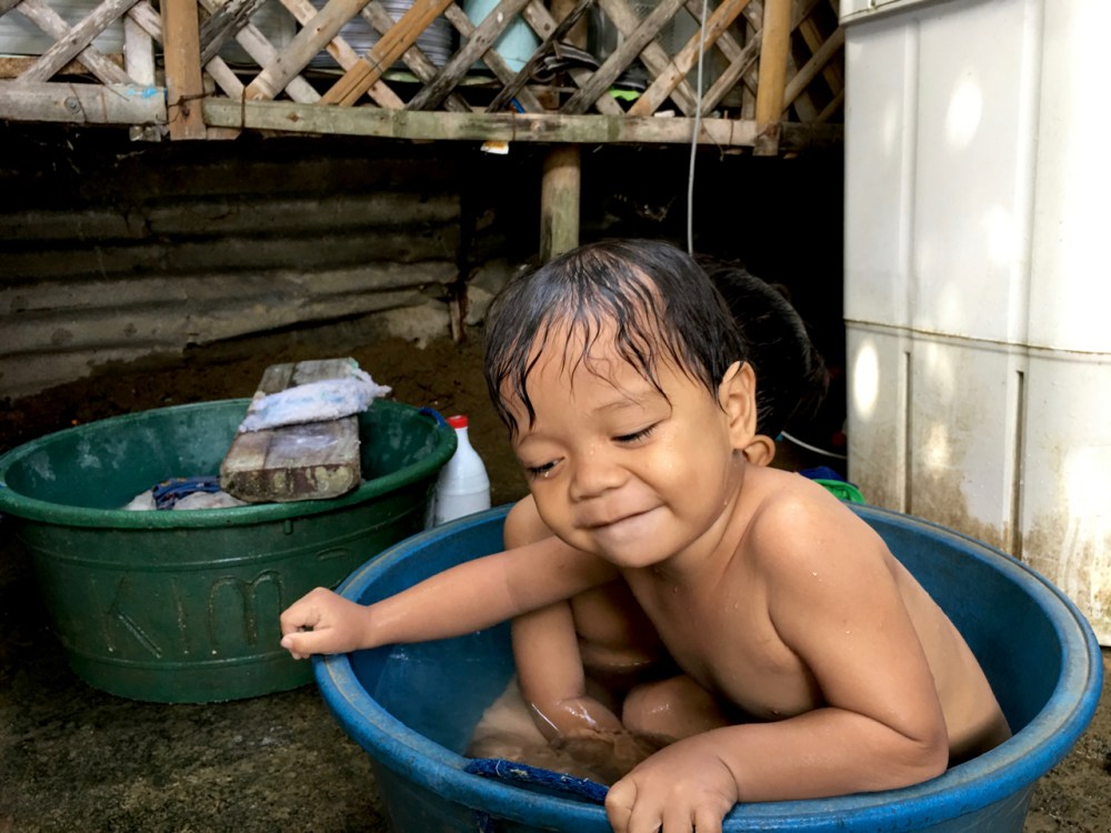two little boys in a laundry tub