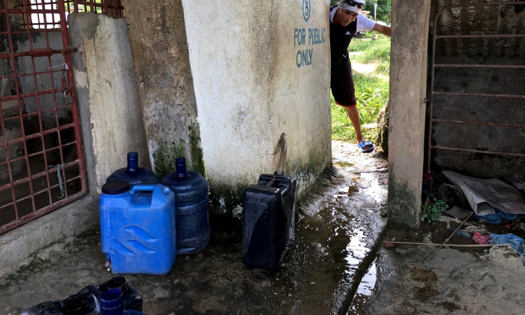 collecting water by Melinda J. Irvine