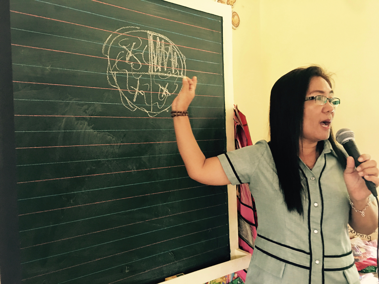 School Principal Ma'am Frecie explains the amount of coral being damaged
