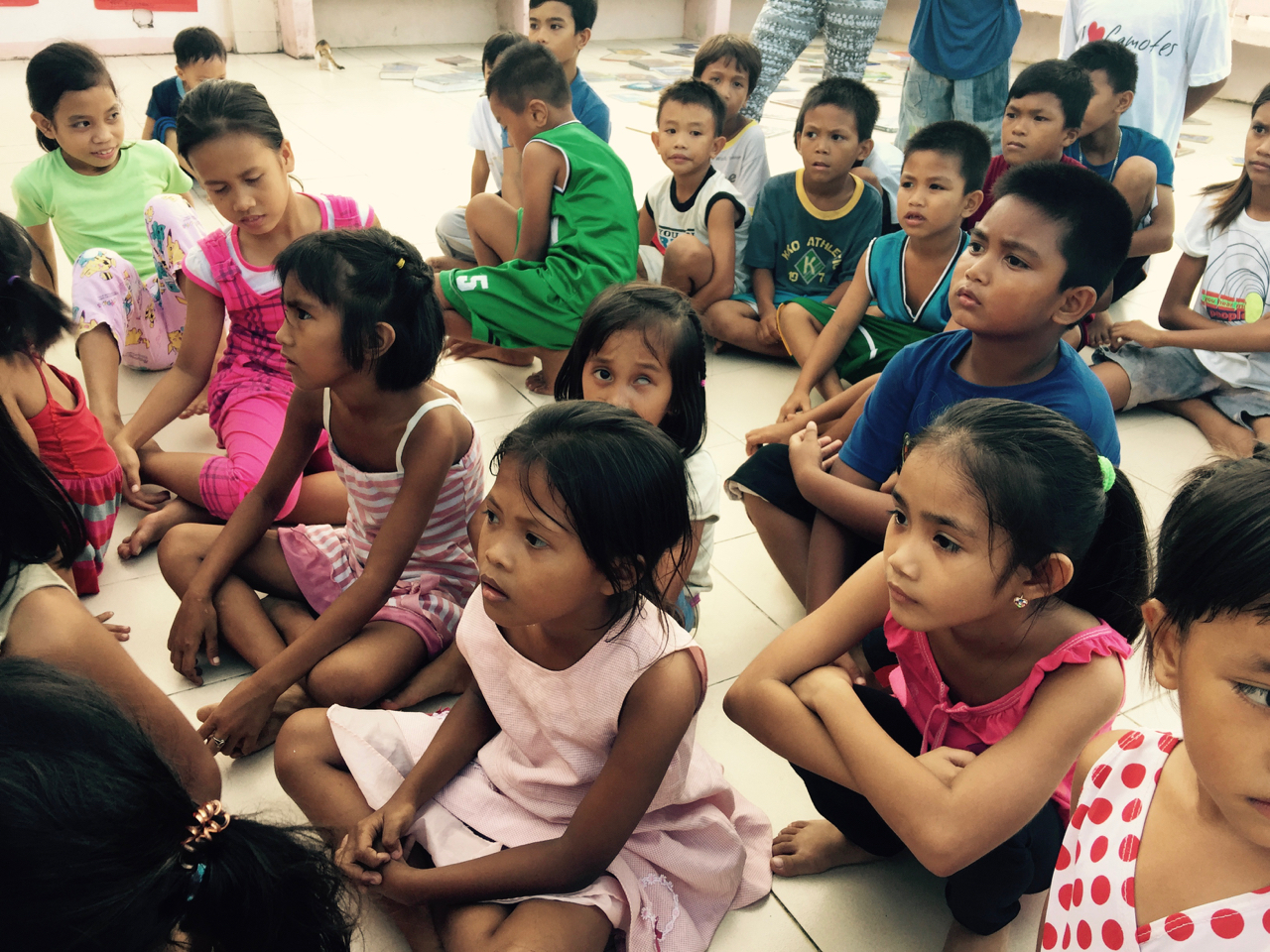 the children listen to a poem by Dr June Perkins