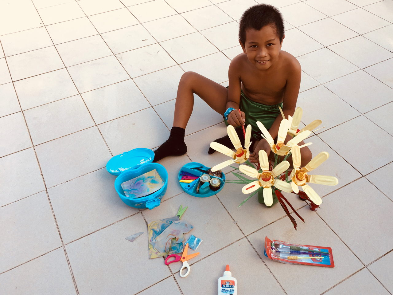 little boy with a school project