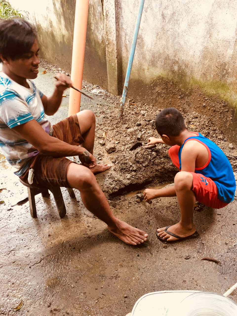 jerry and his brother digging a flood trench